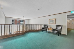 Sitting room featuring ornamental molding and a textured ceiling - 