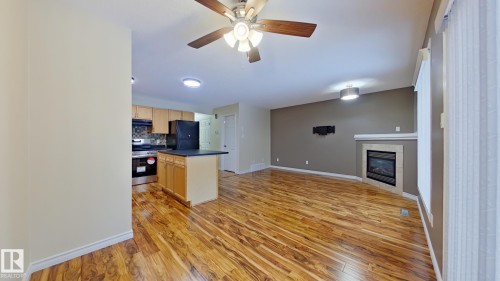 1148 Barnes Way, Edmonton, AB - Indoor Photo Showing Kitchen With Fireplace