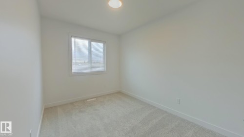 Main 1039 Aster Boulevard, Edmonton, AB - Indoor Photo Showing Other Room