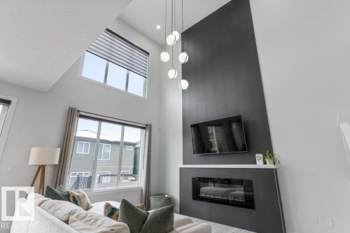 6464 King Wynd, Edmonton, AB - Indoor Photo Showing Living Room With Fireplace