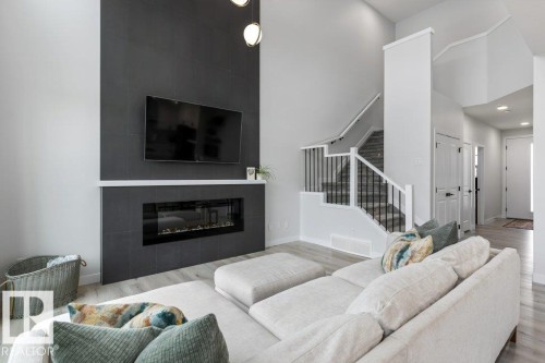 6464 King Wynd, Edmonton, AB - Indoor Photo Showing Living Room With Fireplace