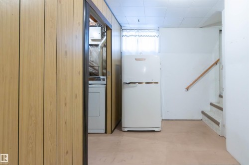 Hallway featuring concrete floors and washer / clothes dryer - 9305 151 Street, Edmonton, AB - Indoor Photo Showing Other Room
