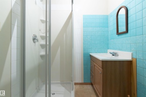 Bathroom with tile walls, vanity, and a stall shower - 9305 151 Street, Edmonton, AB - Indoor Photo Showing Bathroom