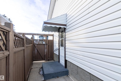View of side of home with a gate - 9305 151 Street, Edmonton, AB - Outdoor With Exterior
