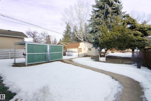 Yard covered in snow featuring a storage shed - 9305 151 Street, Edmonton, AB - Outdoor
