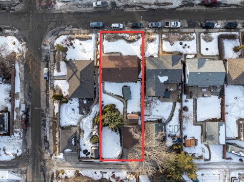 Snowy aerial view with property parcel outlined and a residential view - 9305 151 Street, Edmonton, AB - Outdoor With View
