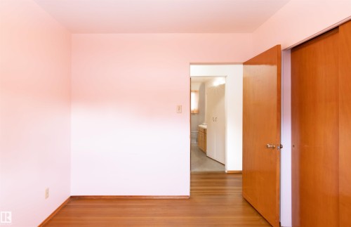 Bedroom with light wood-style flooring and baseboards - 9305 151 Street, Edmonton, AB - Indoor Photo Showing Other Room