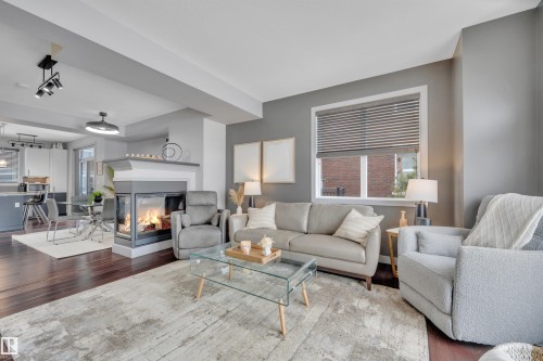 1641 Cunningham Way, Edmonton, AB - Indoor Photo Showing Living Room With Fireplace