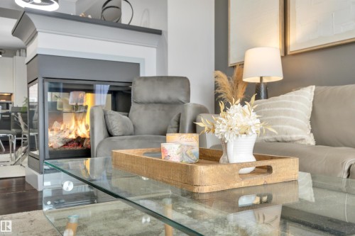 1641 Cunningham Way, Edmonton, AB - Indoor Photo Showing Living Room With Fireplace