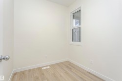 Unfurnished room featuring light wood finished floors and baseboards - 