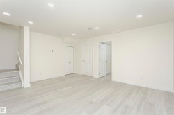 Spare room with light wood finished floors and recessed lighting - 