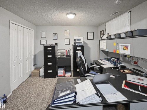 Office with a textured ceiling and carpet - 4602 42 Avenue, Bonnyville Town, AB - Indoor