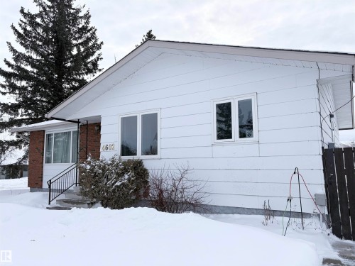Snow covered rear of property featuring brick siding - 4602 42 Avenue, Bonnyville Town, AB - Outdoor With Exterior