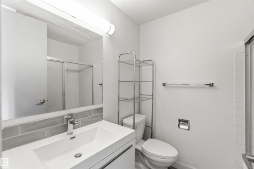 Bathroom featuring vanity and a shower stall - 11615 150 Avenue, Edmonton, AB - Indoor Photo Showing Bathroom