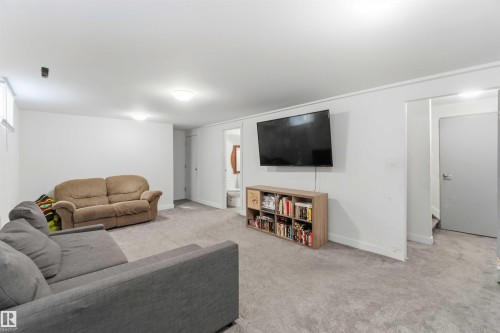 Living room featuring carpet floors - 11615 150 Avenue, Edmonton, AB - Indoor