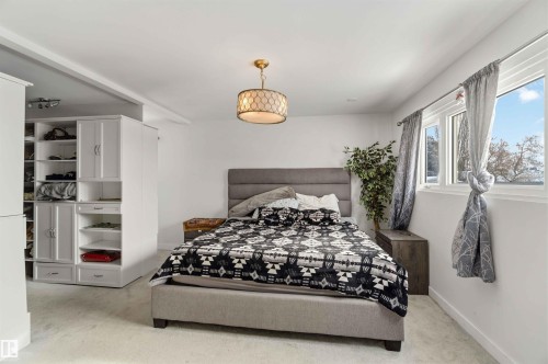 Bedroom featuring baseboards - 11615 150 Avenue, Edmonton, AB - Indoor Photo Showing Bedroom