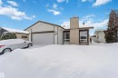 Single story home with a chimney and a garage - 11615 150 Avenue, Edmonton, AB  - Outdoor 
