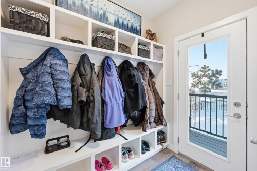Mudroom featuring wood finished floors - 7803 Yorke Road, Edmonton, AB - Indoor With Storage