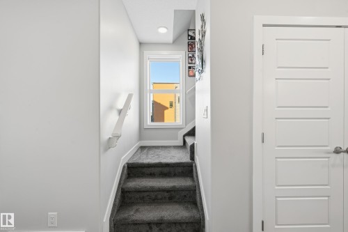 Stairway with carpet floors and baseboards - 7803 Yorke Road, Edmonton, AB - Indoor Photo Showing Other Room