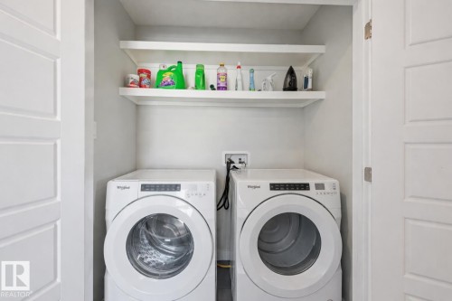 Laundry room with washing machine and dryer - 7803 Yorke Road, Edmonton, AB - Indoor Photo Showing Laundry Room