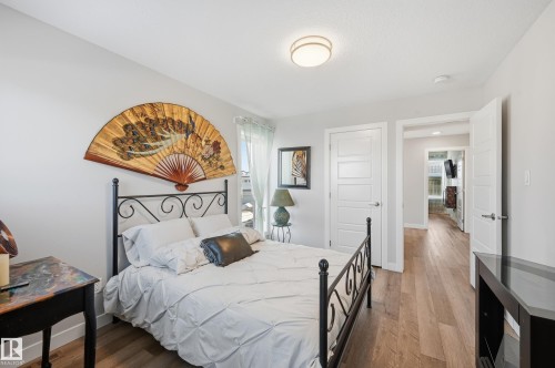 Bedroom featuring wood finished floors and baseboards - 7803 Yorke Road, Edmonton, AB - Indoor Photo Showing Bedroom