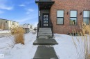 Snow covered property entrance with brick siding - 7803 Yorke Road, Edmonton, AB  - Outdoor 