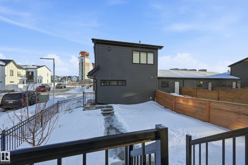 Snow covered rear of property with a fenced backyard and a residential view - 7803 Yorke Road, Edmonton, AB - Outdoor With Exterior