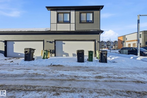 Snow covered house featuring a garage - 7803 Yorke Road, Edmonton, AB - Outdoor