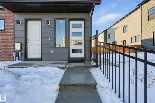 View of snow covered property entrance - 7803 Yorke Road, Edmonton, AB - Outdoor With Exterior