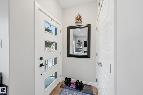 Doorway with wood finished floors - 7803 Yorke Road, Edmonton, AB - Indoor Photo Showing Other Room