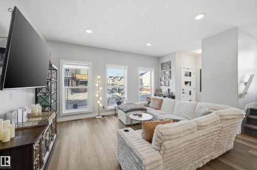 Living room featuring stairs, hardwood / wood-style floors, and recessed lighting - 7803 Yorke Road, Edmonton, AB - Indoor Photo Showing Living Room