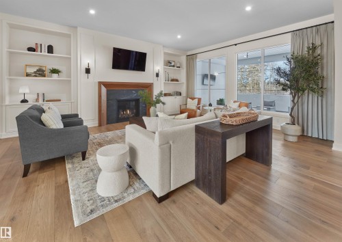 4183 Cameron Heights Point(E), Edmonton, AB - Indoor Photo Showing Living Room With Fireplace