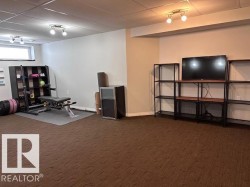 LARGE FINISHED BASEMENT WITH POTENTIAL FOR ANOTHER BEDROOM WITH WINDOW - 