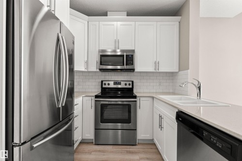 412 12804 140 Avenue, Edmonton, AB - Indoor Photo Showing Kitchen With Stainless Steel Kitchen With Double Sink With Upgraded Kitchen