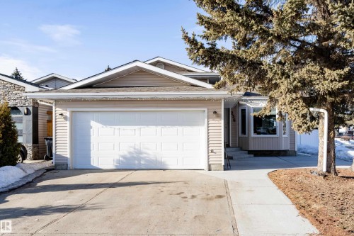 Ranch-style home featuring concrete driveway and a garage - 236 Lago Lindo Crescent, Edmonton, AB 