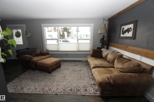 Living room with wood finished floors - 10319 106 Ave, Westlock, AB - Indoor Photo Showing Living Room