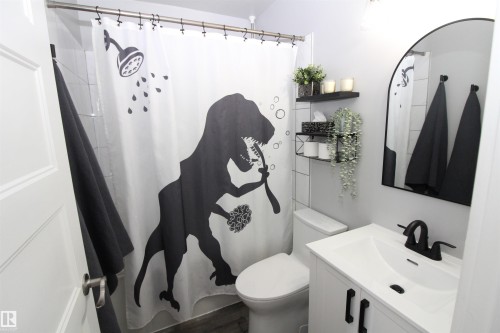 Bathroom featuring vanity and curtained shower - 10319 106 Ave, Westlock, AB - Indoor Photo Showing Bathroom