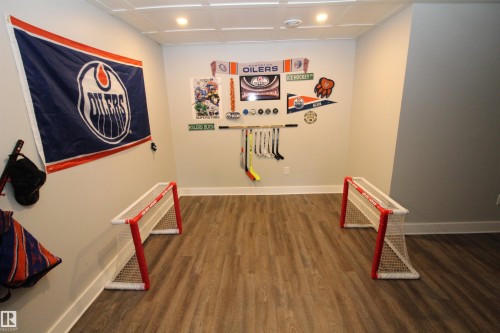 Recreation room featuring recessed lighting and dark wood-style floors - 10319 106 Ave, Westlock, AB - Indoor Photo Showing Other Room
