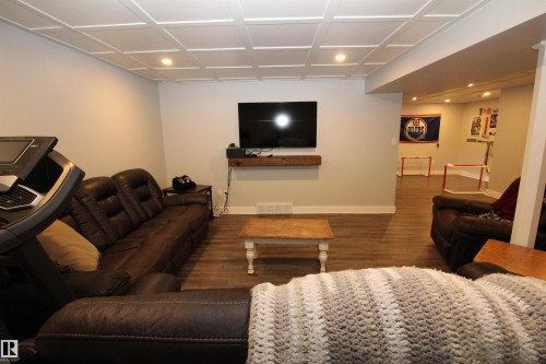 Living room with wood finished floors and recessed lighting - 10319 106 Ave, Westlock, AB - Indoor