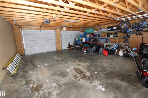 Garage featuring a garage door opener - 10319 106 Ave, Westlock, AB - Indoor Photo Showing Garage