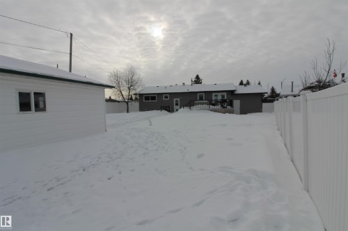 Back of house with a wooden deck - 10319 106 Ave, Westlock, AB - Outdoor