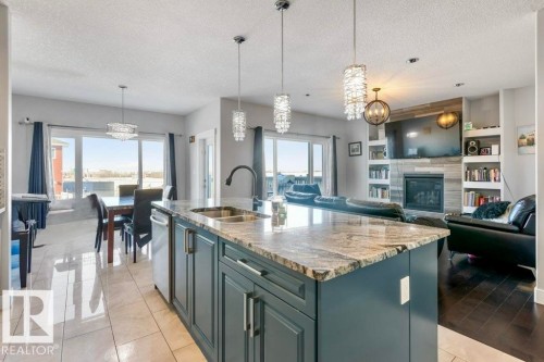 4452 6 Street, Edmonton, AB - Indoor Photo Showing Kitchen With Fireplace With Double Sink With Upgraded Kitchen