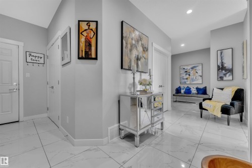 Hall with light marble finish flooring and recessed lighting - 3607 46 Avenue, Beaumont, AB - Indoor Photo Showing Other Room