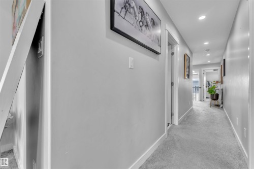 Hall featuring recessed lighting and light carpet - 3607 46 Avenue, Beaumont, AB - Indoor Photo Showing Other Room
