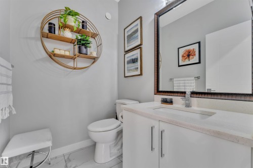 Bathroom with vanity and light marble finish floors - 3607 46 Avenue, Beaumont, AB - Indoor Photo Showing Bathroom