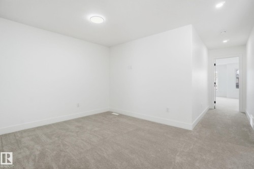 Carpeted spare room with baseboards and recessed lighting - 2408 208 Street, Edmonton, AB - Indoor Photo Showing Other Room