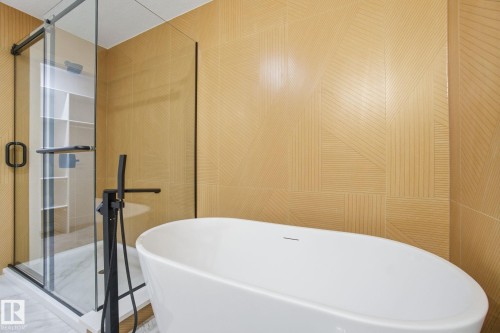 Bathroom with a soaking tub and a stall shower - 2408 208 Street, Edmonton, AB - Indoor Photo Showing Bathroom