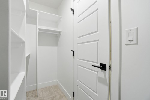 Walk in closet with light colored carpet - 2408 208 Street, Edmonton, AB - Indoor