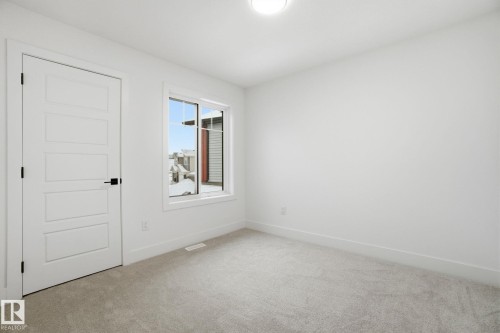 Empty room featuring light carpet - 2408 208 Street, Edmonton, AB - Indoor Photo Showing Other Room