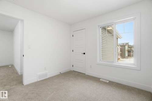 Empty room featuring carpet and baseboards - 2408 208 Street, Edmonton, AB - Indoor Photo Showing Other Room